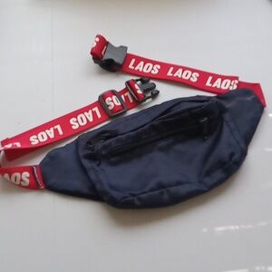 Navy blue Fanny pak with red and white printed logo waist band